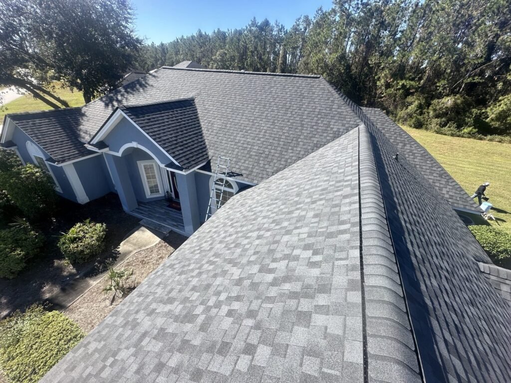 Close-up of a finished architectural shingle roof and ridge