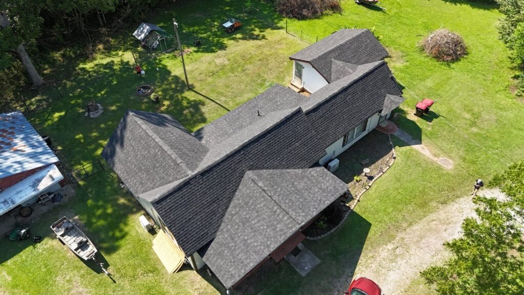 Completed roof replacement on a country home, drone photo