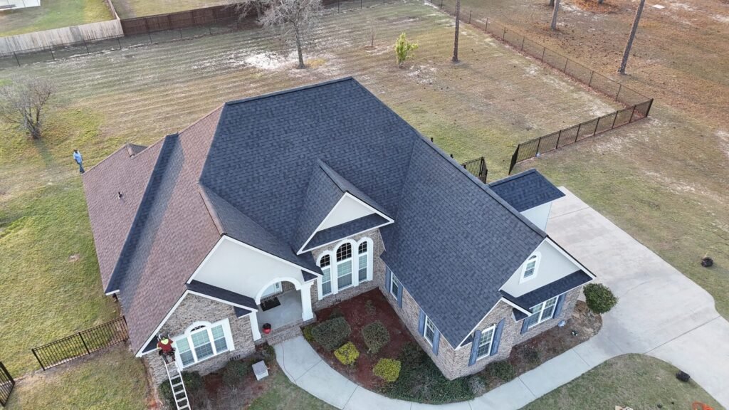 Roof replacement on a brick home, drone front view