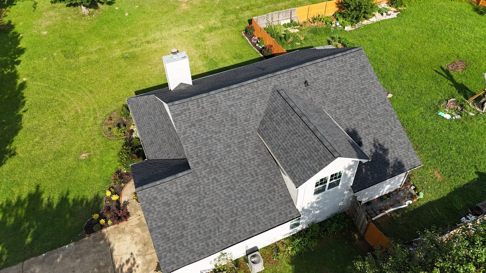 Finished Moire Black shingle roof replacement in Locust Grove, GA — drone view