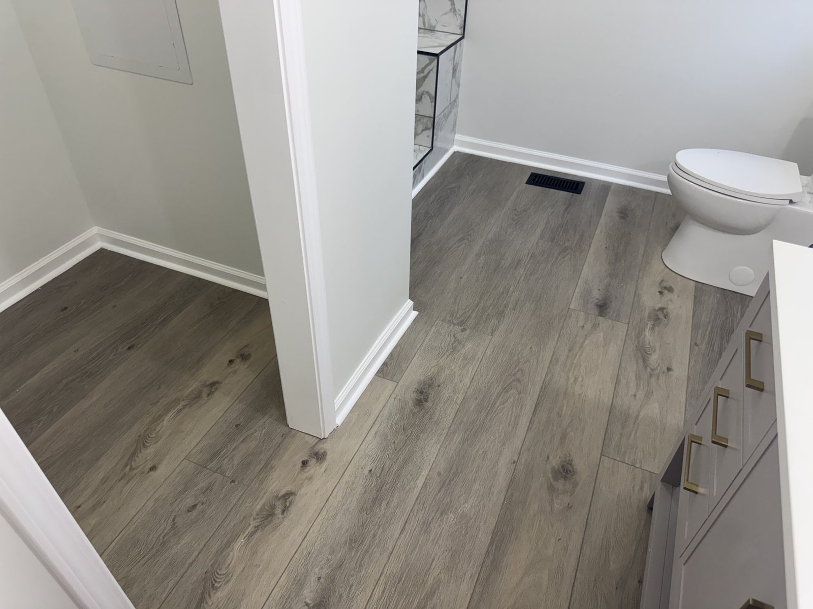 Finished bathroom remodel with LVP flooring, Georgia