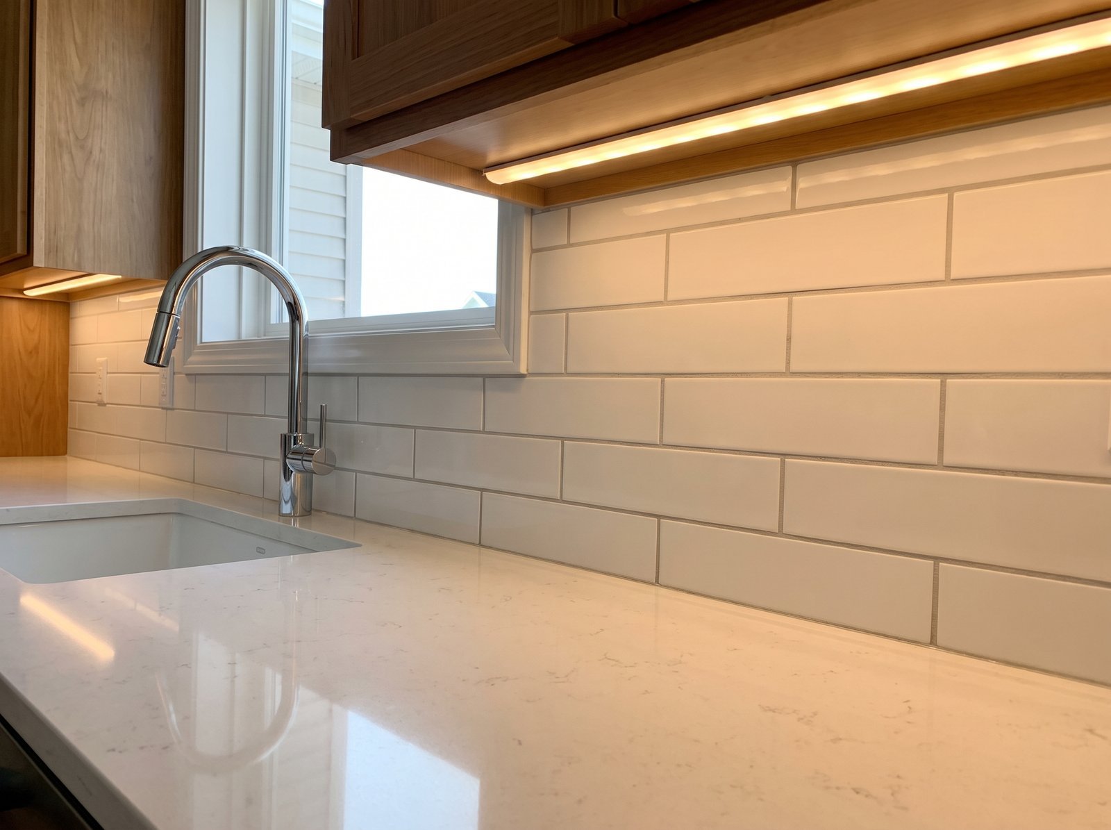 Example of a new tile backsplash and countertop in a kitchen
